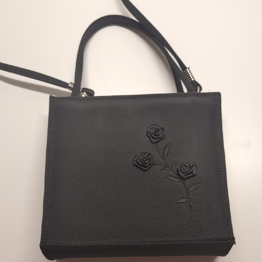 Elegant Black Handbag with Floral Design